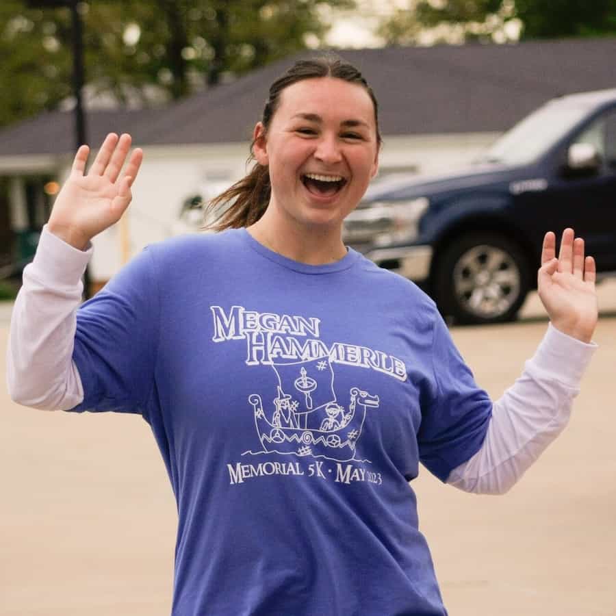 A walker at the Megan Hammerle 5K in 2023 poses for the camera with a broad smile.